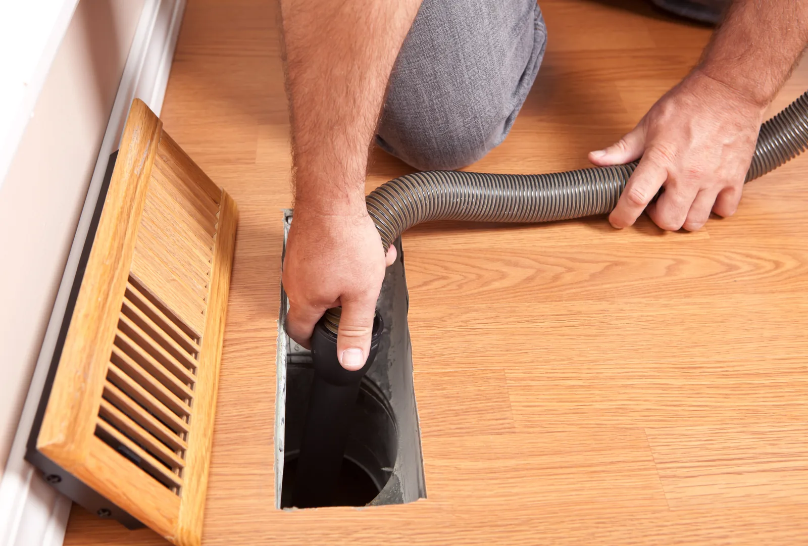 Professional HVAC air duct cleaning in progress